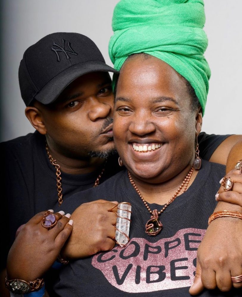 Monyia and Juma, the founders of Copper Vibrations, wearing their copper and crystal jewelry